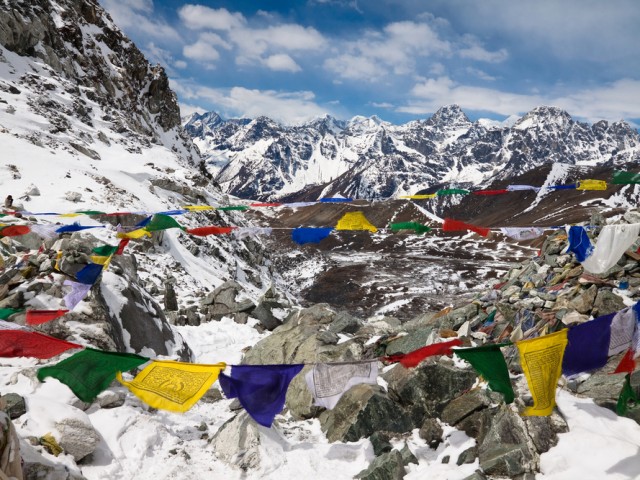 Prayer flags in the mountains. Cho La Pass